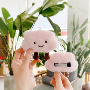 Set of two pink plush cloud hair clips with cute smiling face and metal duckbill clip