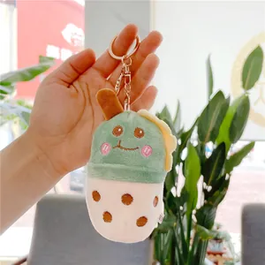 Cute green plush boba tea keychain with smiley face and golden metal clasp for bags