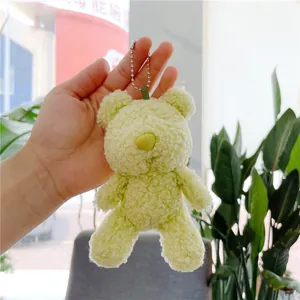 Light green plush teddy bear keychain with curly faux fur and silver metal bead chain