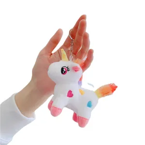 Cute white plush unicorn keychain with rainbow hair and heart embroidery detail