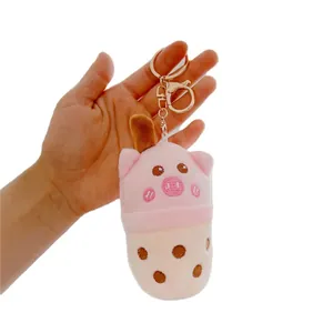 Cute pink pig plush keychain in bubble tea cup shape with golden lobster clasp and ring
