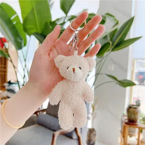 Cute teddy bear plush keychain in cream white textured fabric with silver metal ring
