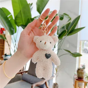 Cute teddy plush bear keychain with heart embroidery and golden metal clasp for bags