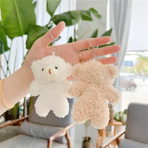 Cute teddy bear plush keychains in white and khaki with fluffy fur and metal rings