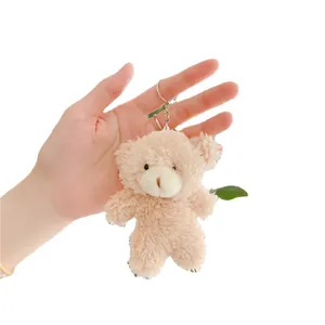 Cute teddy bear plush keychain with soft curly fur and silver ring for bag accessories