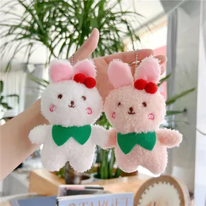 Cute cherry rabbit plush keychain set with soft fur and pink embroidery in hand