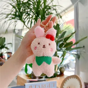 Cute pink plush bunny keychain with red bow and gold ring for girls bag decoration