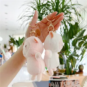 Cute rainbow sheep plush keychain in pink and white with gold metal rings for women