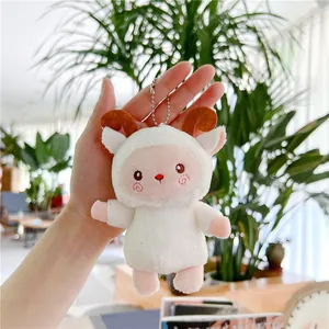 Close-up of cute plush lamb keychain with brown horns and metal bead chain for girls