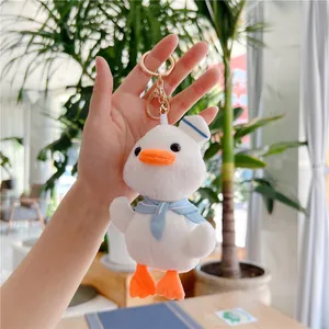 Cute white plush duck keychain with sailor hat and blue scarf for bags and keys