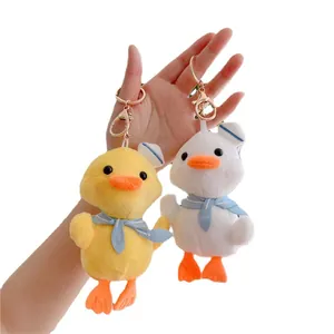 Cute plush duck charms in yellow and white colors with sailor hats and metal keychains