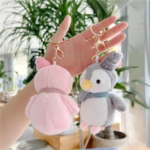 Cute plush penguin and duck keychain pendants with knitted hats and golden clasps