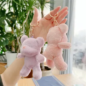 Plush teddy bear keychain pendants in pink and purple with soft long fiber fur texture