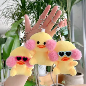 Three cute yellow plush duck keychains with pink cheeks and heart-shaped sunglasses