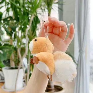 Close-up of cute plush squirrel keychain with soft fur and silver ball chain
