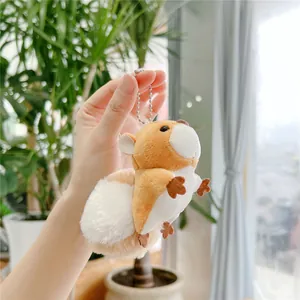 Close-up of cute plush squirrel keychain with soft fur and silver bead chain accessory