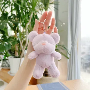 Close-up of light purple plush teddy bear charm with a silver metal keychain