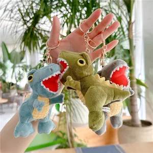 Cute dinosaur plush toy keychains in blue green and grey with gold metal clips