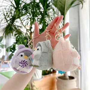 Three cute penguin plush charms with ice cream themes and golden metal keychains