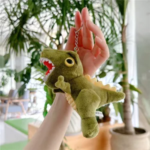 Close-up of a green plush dinosaur keychain with soft fabric and durable metal ring