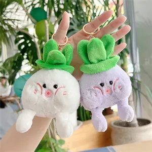 Cute plush cabbage and purple vegetable keychains with embroidered details on hand