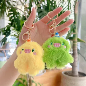 Close-up of colorful plush monster keychains with soft faux fur and embroidery