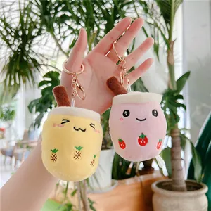 Cute plush bubble tea keychains with strawberry and pineapple embroidery details