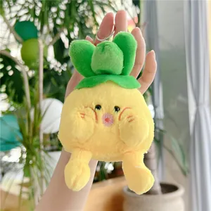 Close-up of cute plush pineapple keychain with soft texture and metal keyring
