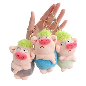 Set of three cute plush pig keychains with funny expressions and colorful hair