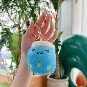 Detail of blue plush bubble tea keychain with cute embroidery and gold metal clip