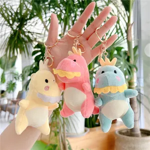 Simpatici portachiavi dinosauro in peluche giallo, rosa e blu con corona e anello dorato