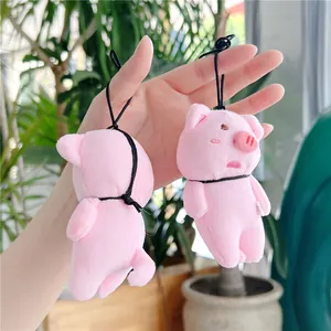 Plush pink pig charms for bags and keys featuring cute embroidered facial details