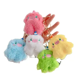 Five colorful plush monster keychains with soft faux fur and golden metal hooks