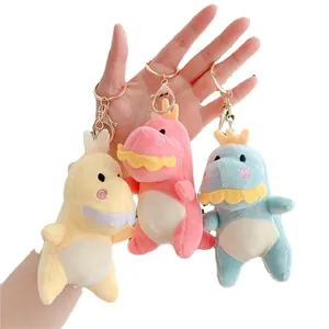 Set di portachiavi a forma di dinosauro in peluche giallo, rosa e blu con chiusura