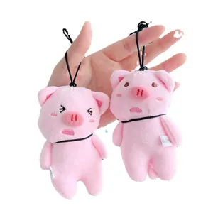 Cute pink plush pig keychain pendants with soft fabric and charming facial expressions
