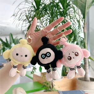 Lot de porte-clés en peluche mignons en jaune, noir et rose avec des jambes rayées