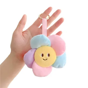 Bunter Plüsch-Sonnenblumen-Schlüsselanhänger mit gelbem Smiley und Pastell-Blüten