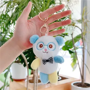 Cute panda plush keychain with blue glasses and plaid bowtie on a gold metal clasp