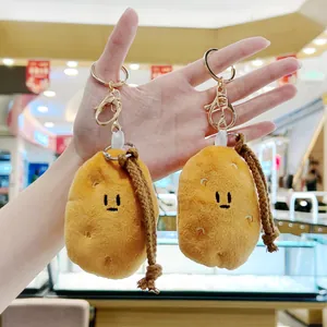 Cute plush potato keychain charms for bags with soft fabric and golden metal hooks