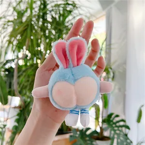 Close-up of funny blue plush bunny keychain with peach butt design and striped legs