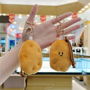 Cute potato plush keychain with cartoon embroidery and a brown braided lanyard strap
