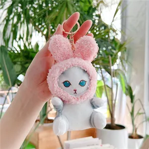 Cute plush cat keychain wearing a pink bunny ear hoodie with golden metal ring