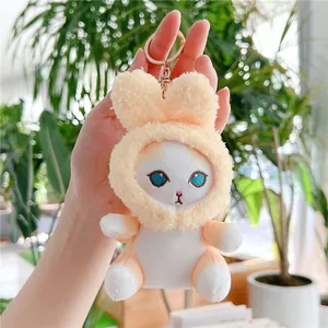 Detail of cute yellow rabbit plush keychain with soft texture and golden metal ring