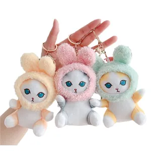 Three cute plush cat keychains with rabbit ear hoods in yellow, pink, and green colors