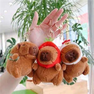 Detailed trio of brown Capybara plush keychains with turtle, strawberry, and chicken hats