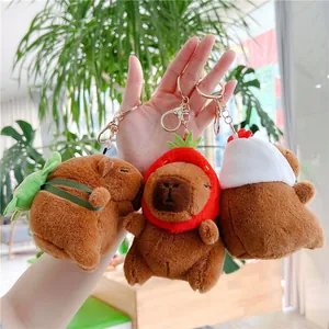 Plush Capybara keychains featuring strawberry hat, chef hat and green leaf bag designs