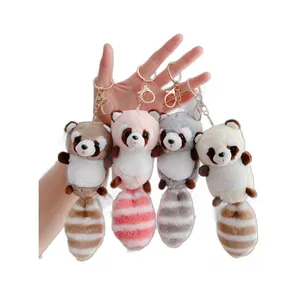 Cute plush raccoon keychains in four colors with gold metal rings for bag decoration