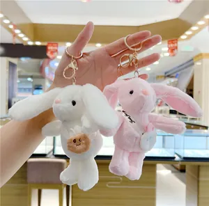 Cute long-eared plush bunny keychains in pink and white with gold lobster clasps