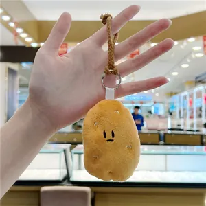 Cute plush potato pendant with metal keychain loop and brown braided strap for bags