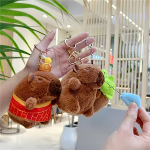 Porte-clés peluche capybara mignon avec couronne et petit sac à dos tortue vert